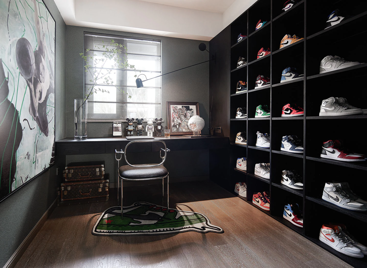 Dark sneaker display room with wall-mounted shoe shelves